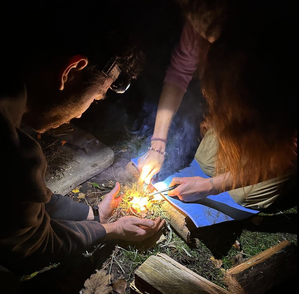 Hands-on fire-making — intimate, real, focused