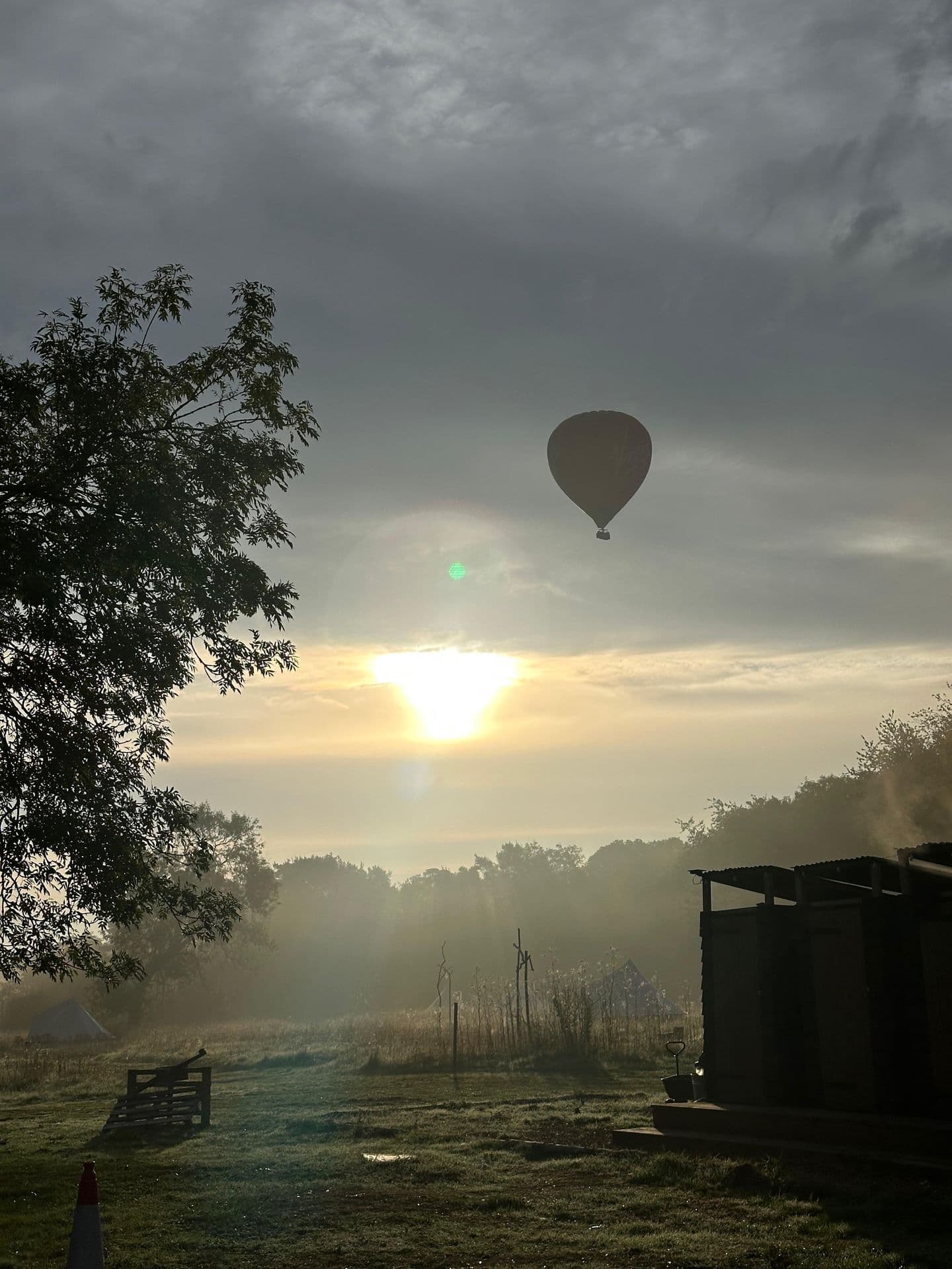 Misty sunrise over a rural field — dreamlike and peaceful